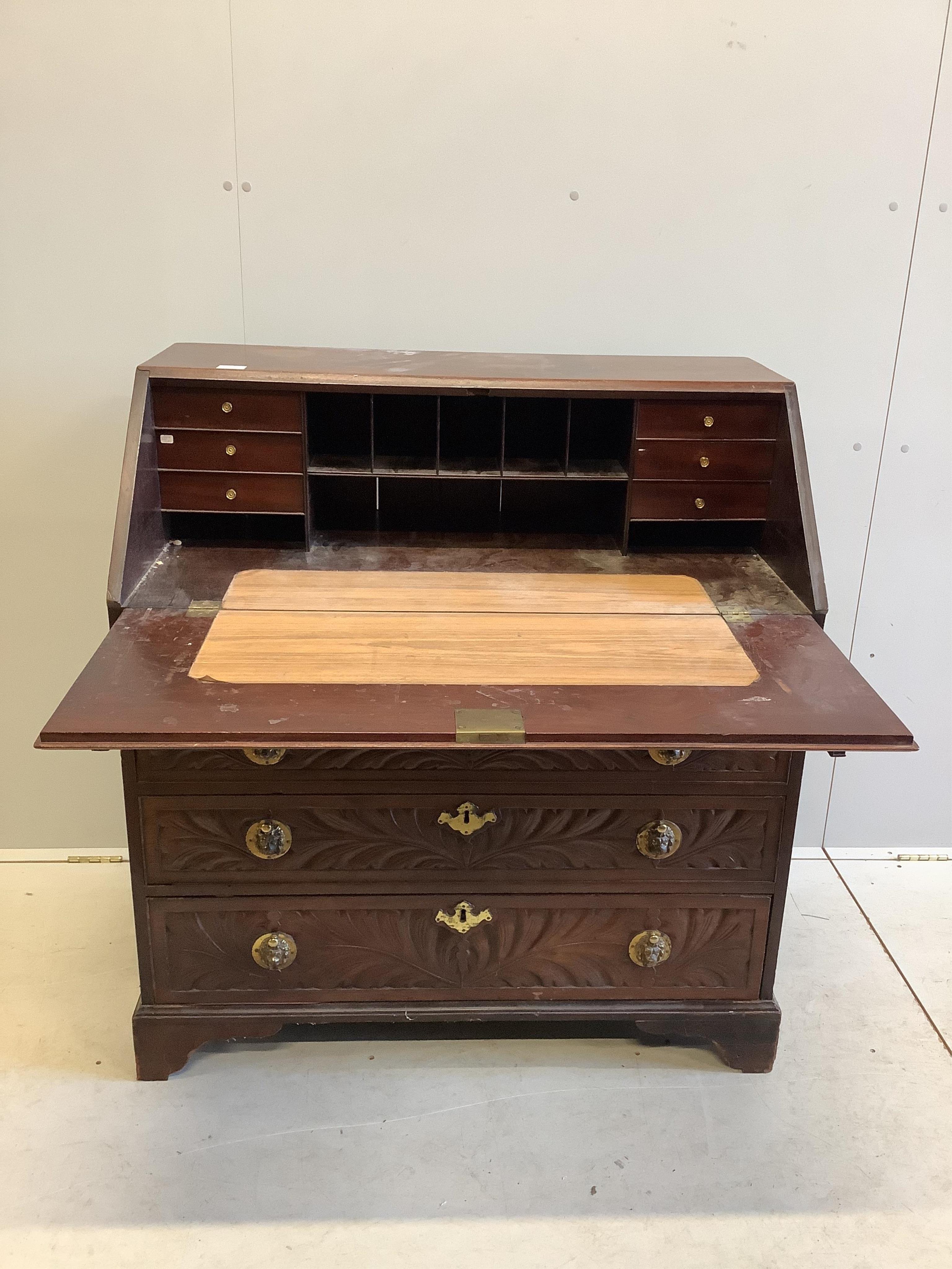 A George III later carved mahogany bureau, width 99cm, depth 56cm, height 106cm. Condition - fair